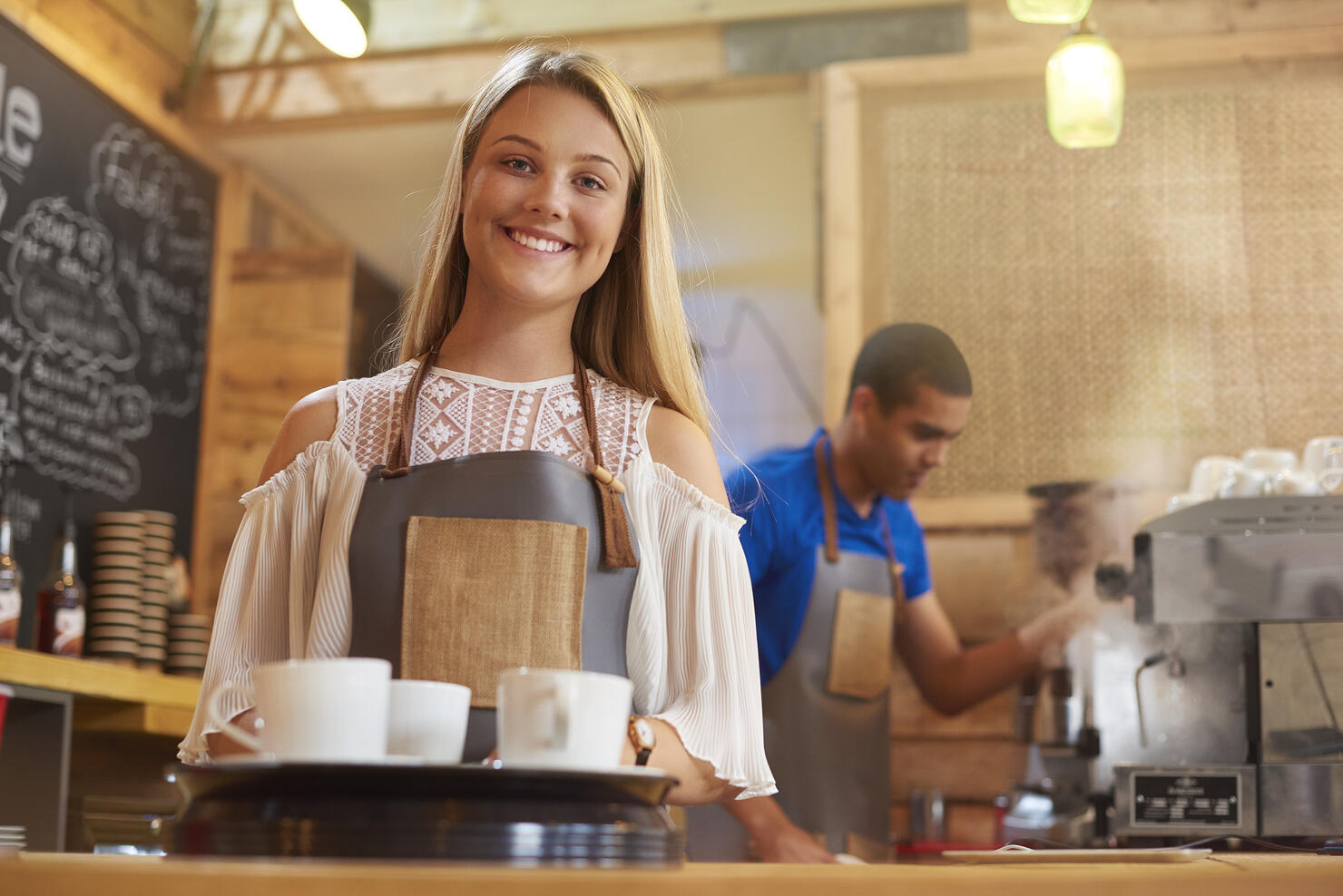 happy young female barista