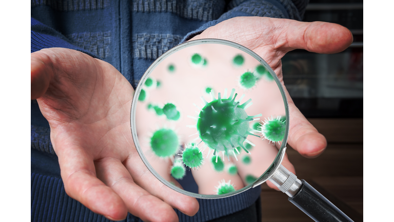 Hygiene concept. Man is showing dirty hands with many viruses and germs.