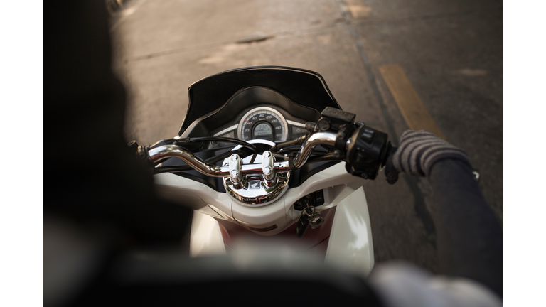 Cropped Image Of Person On Scooter