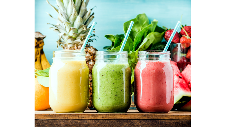 Freshly blended fruit smoothies of various colors and tastes