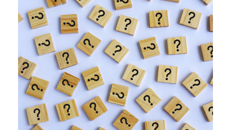 Question Marks on Wooden Block White Background