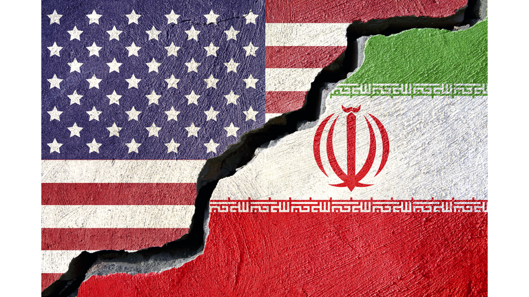 Concept american and Iran flag on cracked background