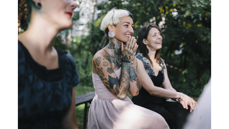Wedding guest looks on as friends get married