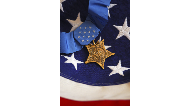 The Medal of Honor rests on a flag during preparations for an award ceremony.