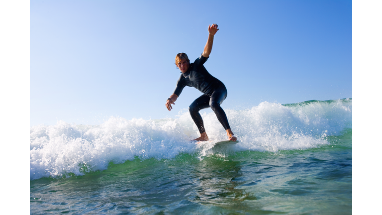 Man surfing a wave.