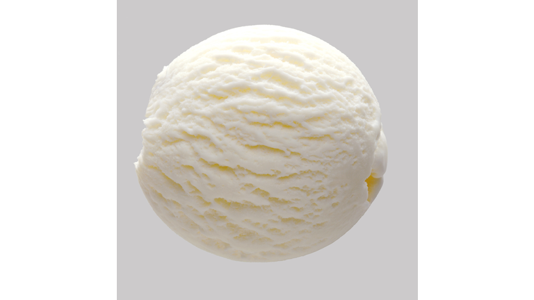 Scoop of vanilla ice cream isolated on gray