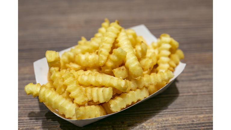 Heap of french fries in a box