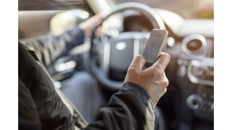 Texting while driving using cell phone in car