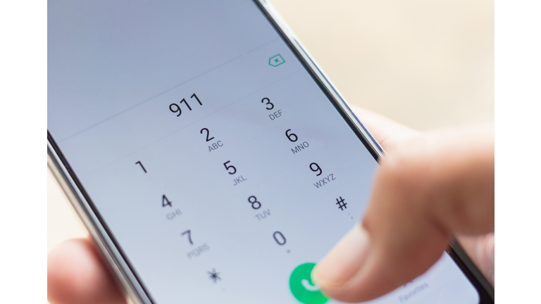 Emergency and urgency, dialing 911 on smartphone screen. Shallow depth of field.