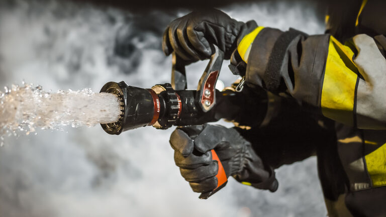 Firefighter using extinguisher