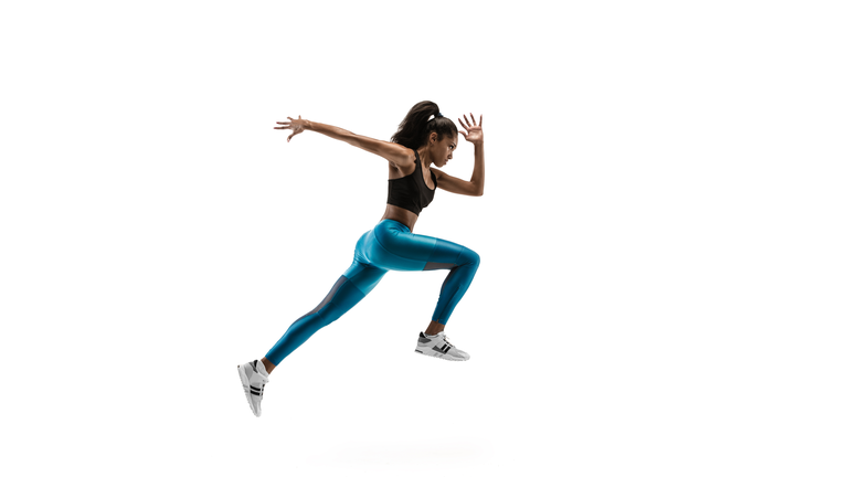 Young african woman running or jogging isolated on white studio background.