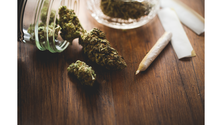 Marijuana in a jar. Cannabis joint. Medical or recreative