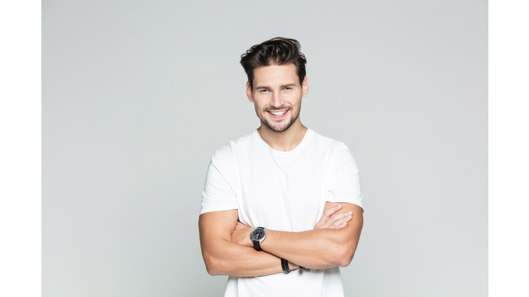 Young man standing confidently