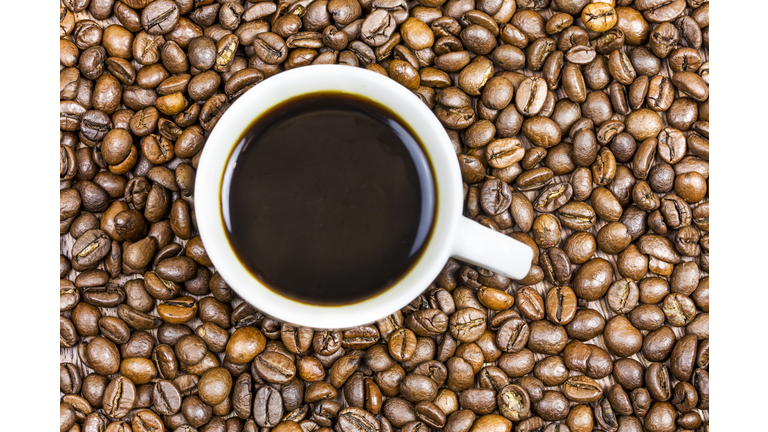 Cup coffee with coffee beans