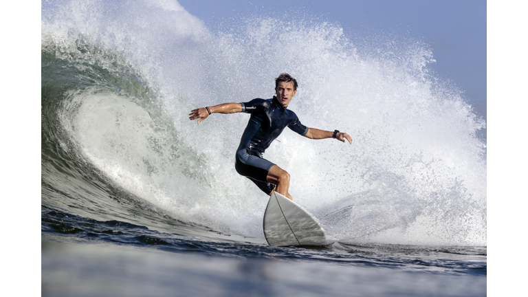 Low angle view of man surfing on sea