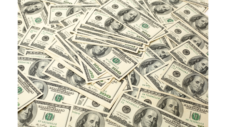 Pile of banknotes of one hundred dollars. Selective focus. Closeup. Background