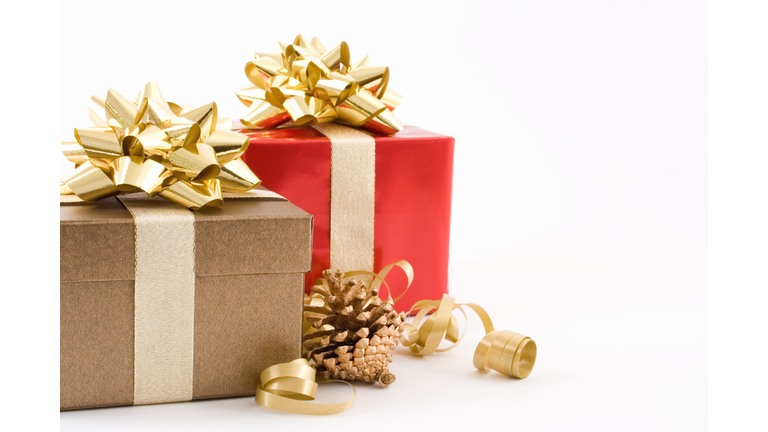 Christmas presents neatly wrapped with golden bows