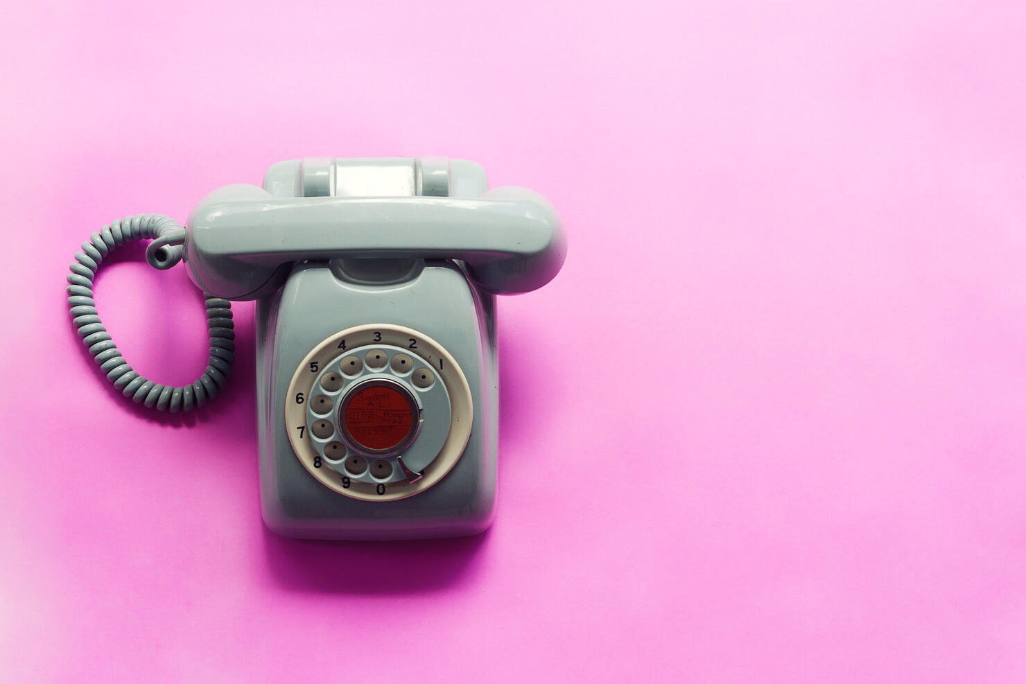 Close-Up Of Telephone On Pink Background