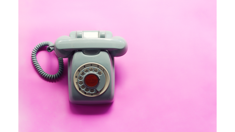 Close-Up Of Telephone On Pink Background