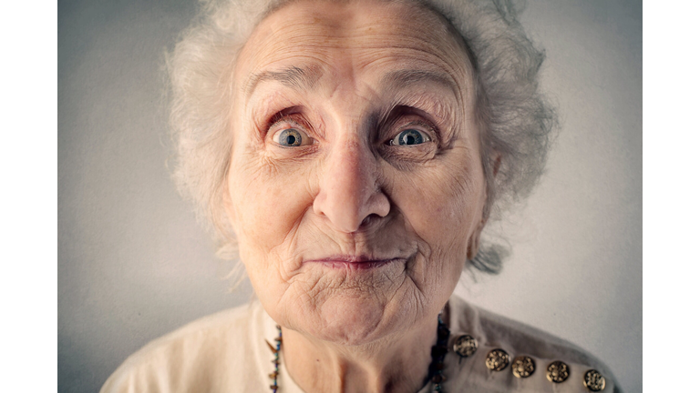 Portrait of surprised old woman