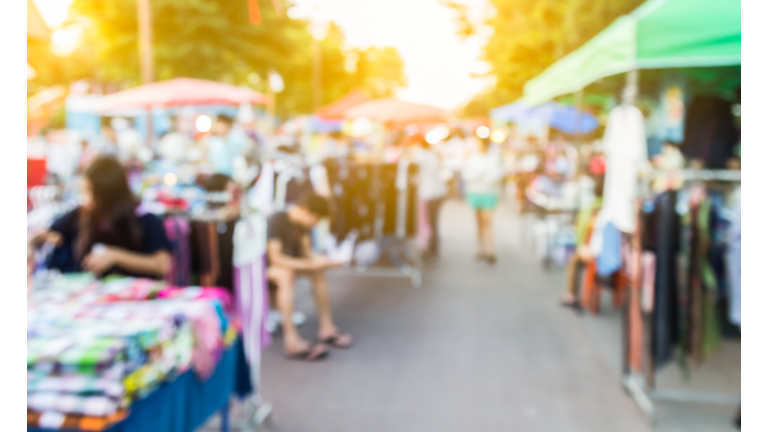 abstract blur background of people shopping at market fair, made