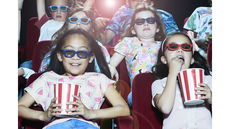 Group of children enjoying a movie at the cinema