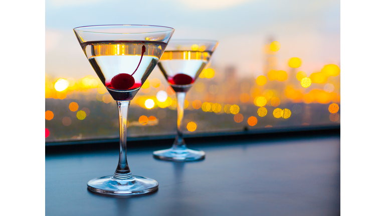 Cocktail glasses with city view