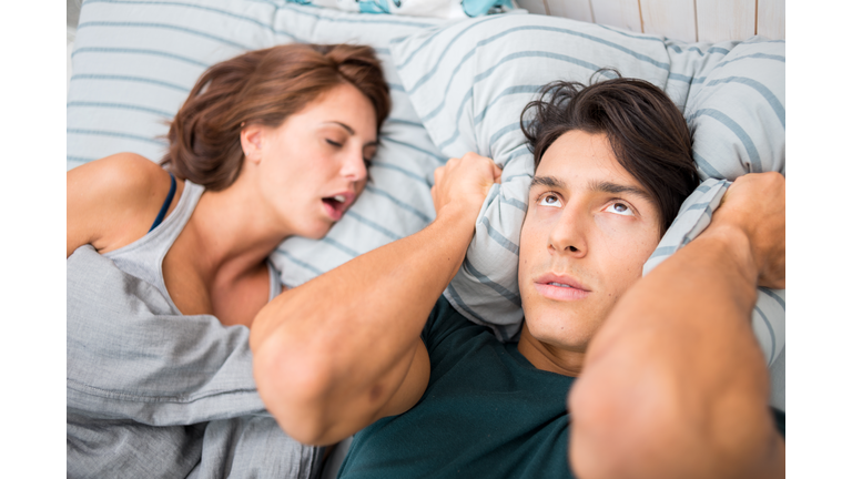 Man cannot sleep because his wife snores