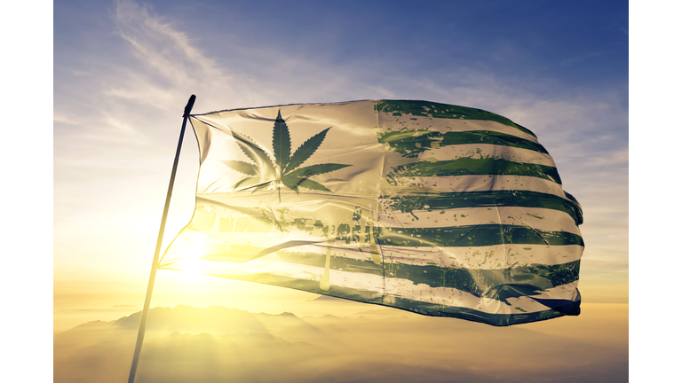 USA flag paint weed mariguana marijuana flag textile cloth fabric waving on the top sunrise mist fog