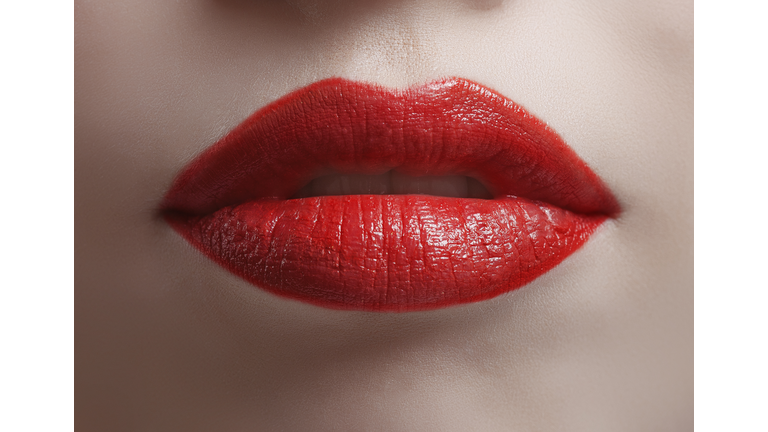 Close up of bright red shiny lips