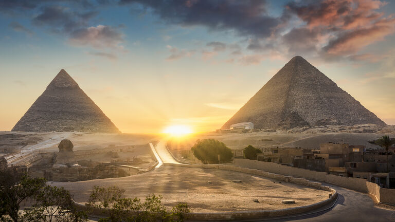 View of The Great Sphinx, Pyramid of Khafre and Great Pyramid of Giza at sunset, Cairo, Giza, Egypt