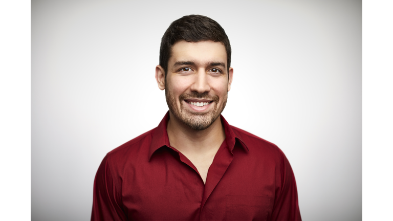 Confident young man wearing red shirt