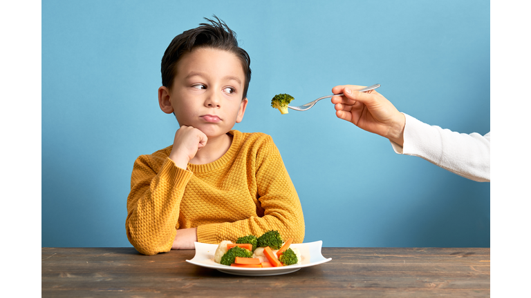 Child is very unhappy with having to eat vegetables. And mom should just go with it. That kid will fart out of spite. 