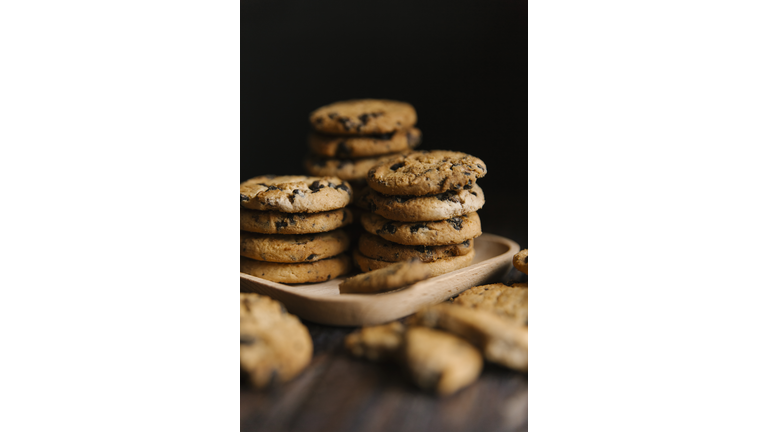 Close-up of cookies in tray on table against black background