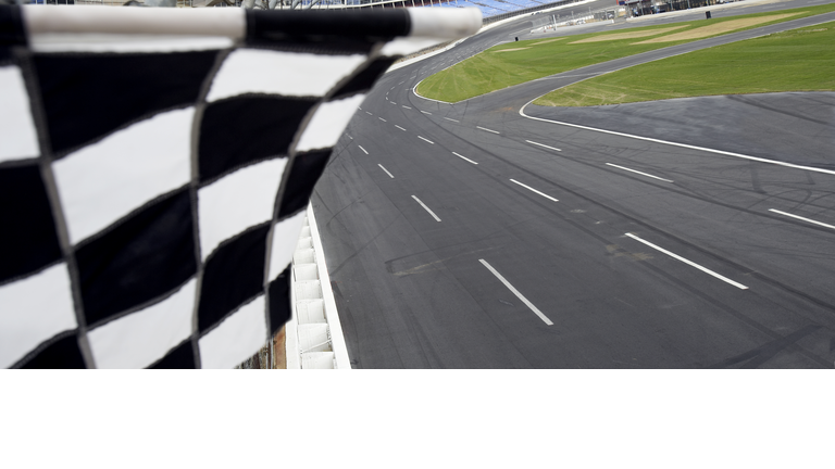 Checkered flag and motor speedway