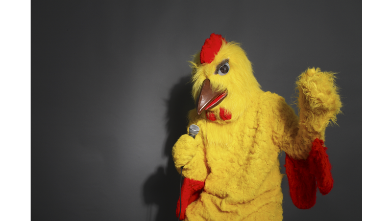 Person in chicken costume singing