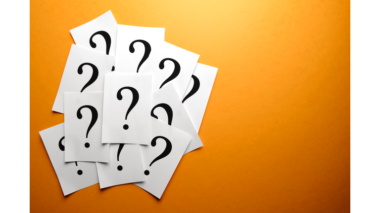 Question marks on paper