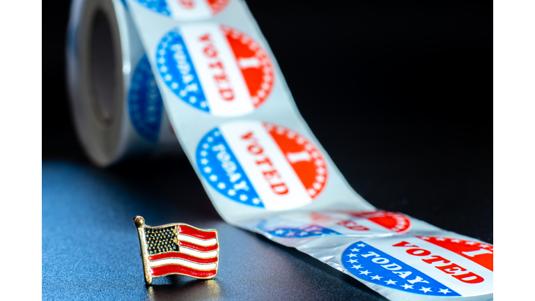 American flag on I voted today stickers, patriotic motive during the elections of the American president.