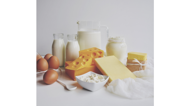 Close-Up Of Dairy Products On Table Against White Background