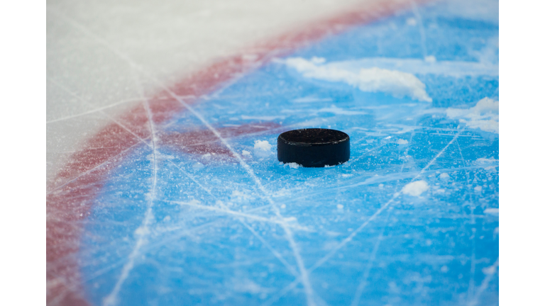 Close-Up Of Hockey Puck In Ice Rink