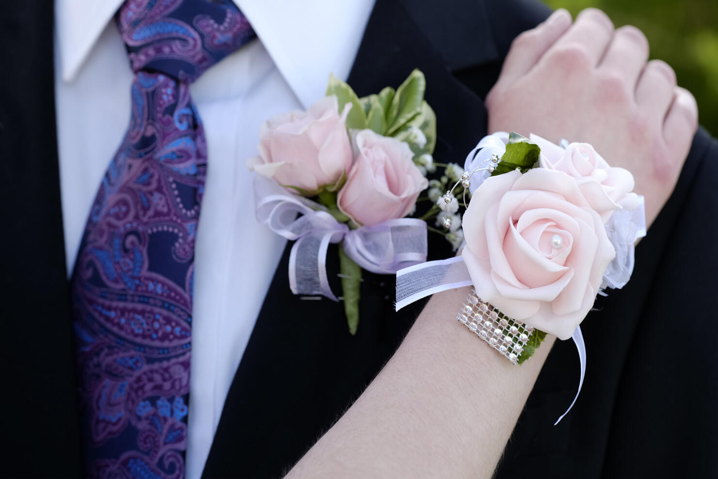 Hands of date Prom night flowers corsage formal wear