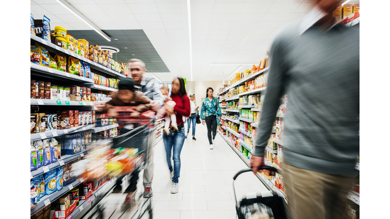 Busy Supermarket Aisle With Customers