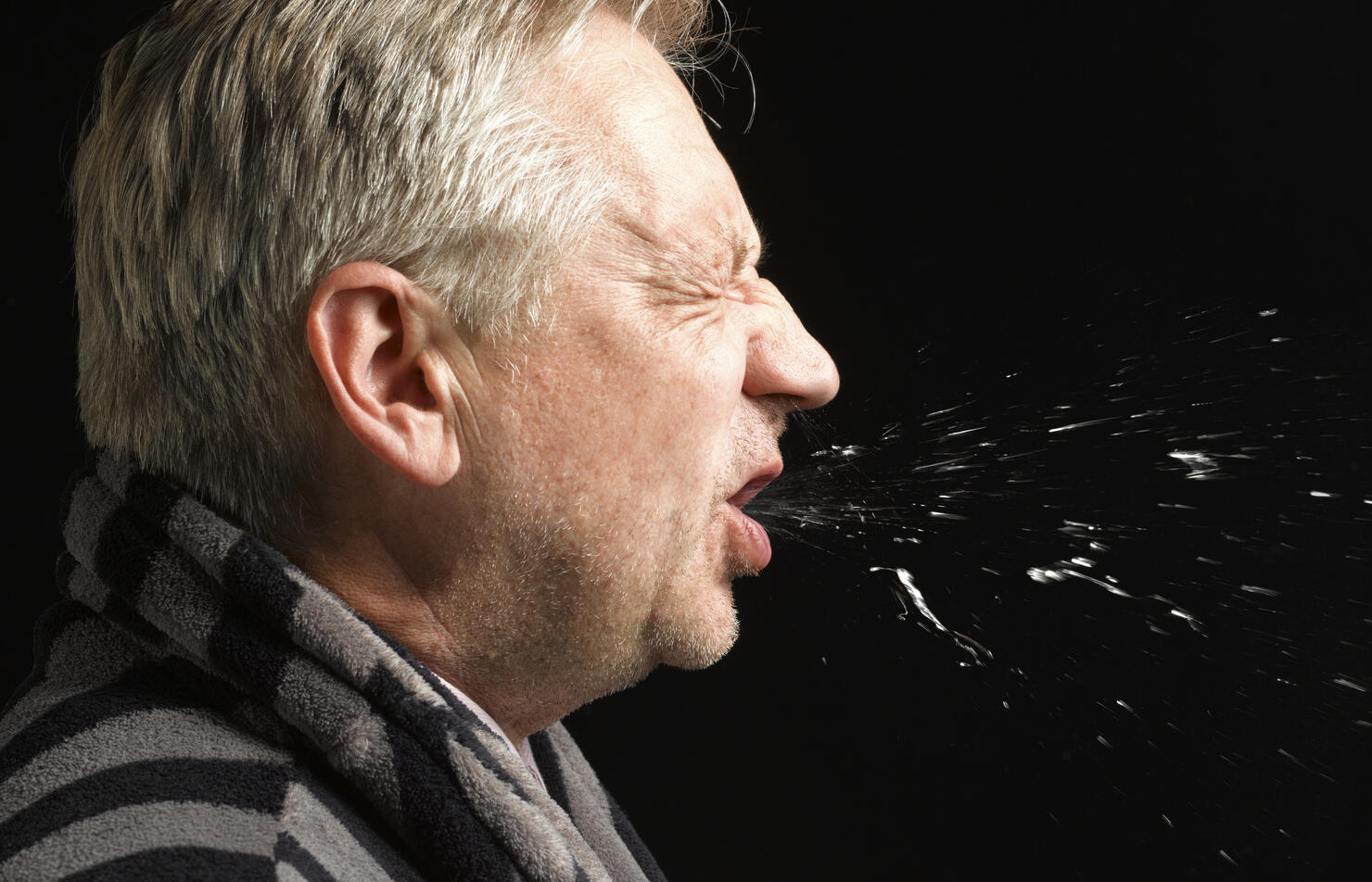 Man with flu coughing and sneezing