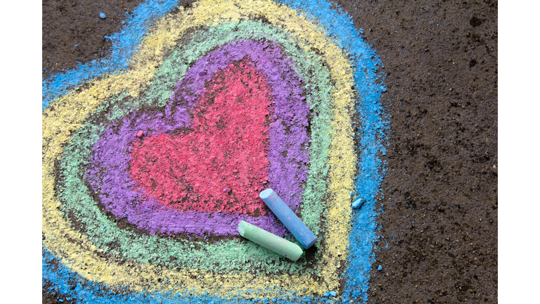 chalk drawing: colorful hearts on asphalt