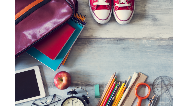 School supplies on wooden background