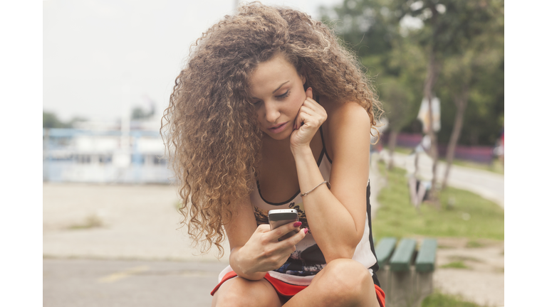 Teenage girl texting on the phone
