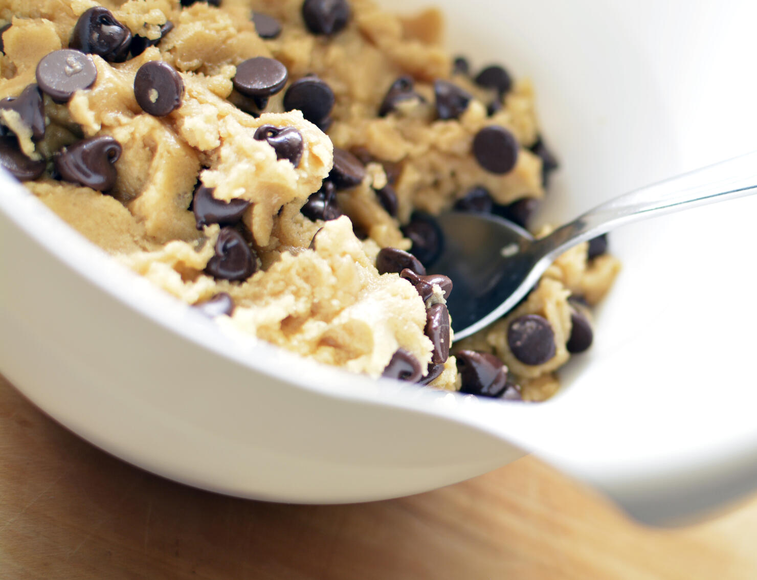Chocolate Chip Cookie Dough in mixing bowl with spoon