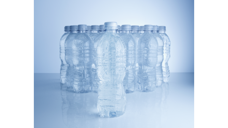 Multiple plastic bottles of water