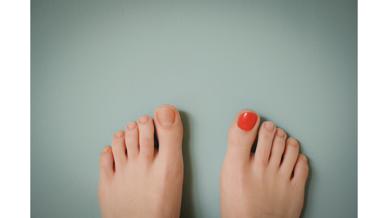 Red nail polished toe