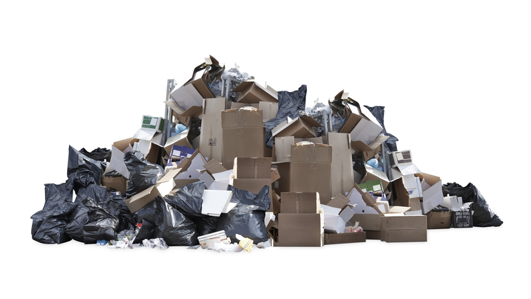 Heap of black garbage bags, cardboard boxes and other trash